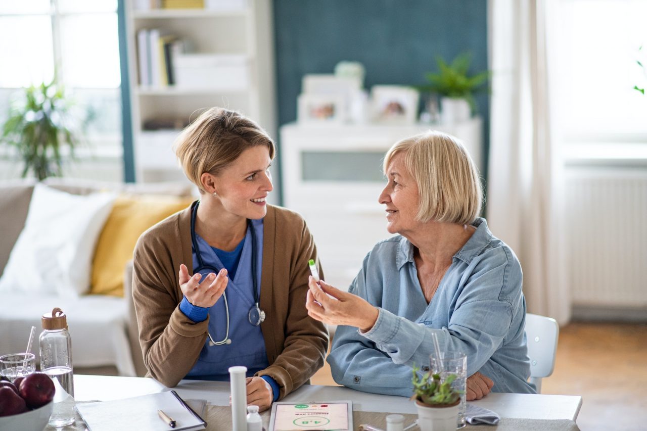 caregiver talks with a senior woman