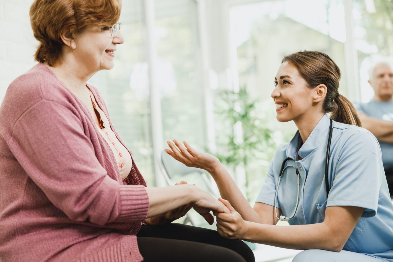 nurse talking to a senior woman